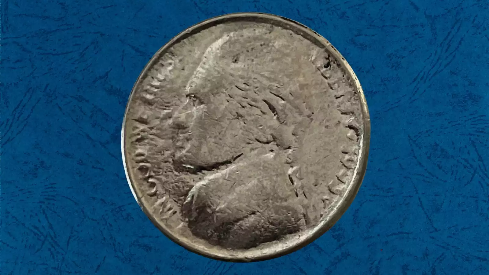 1993 Jefferson nickel struck-through-grease error showing filled, missing detail in Jefferson's portrait area